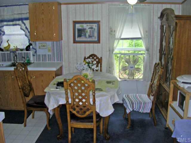 153 Stoney Mountain Road Rougemont, NC 27572 - Photo 4 of 12 a view of a dining room with furniture and a window
