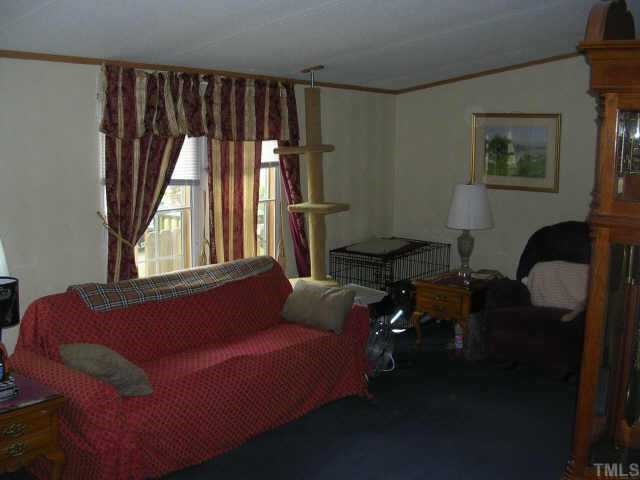 153 Stoney Mountain Road Rougemont, NC 27572 - Photo 6 of 12 a living room with furniture and a large window