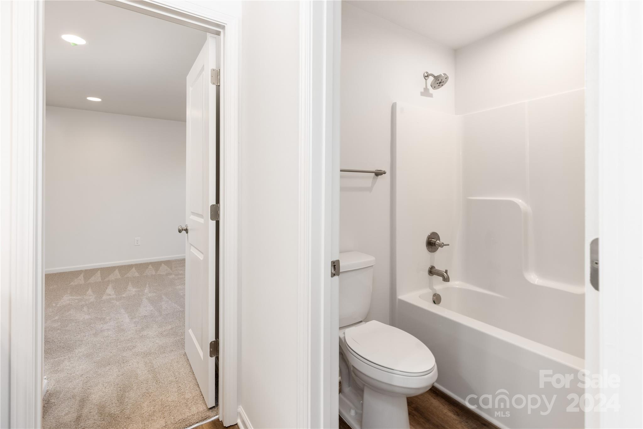 4317 Perkins Road Charlotte, NC 28269 - Photo 18 of 29 a bathroom with a toilet and a shower