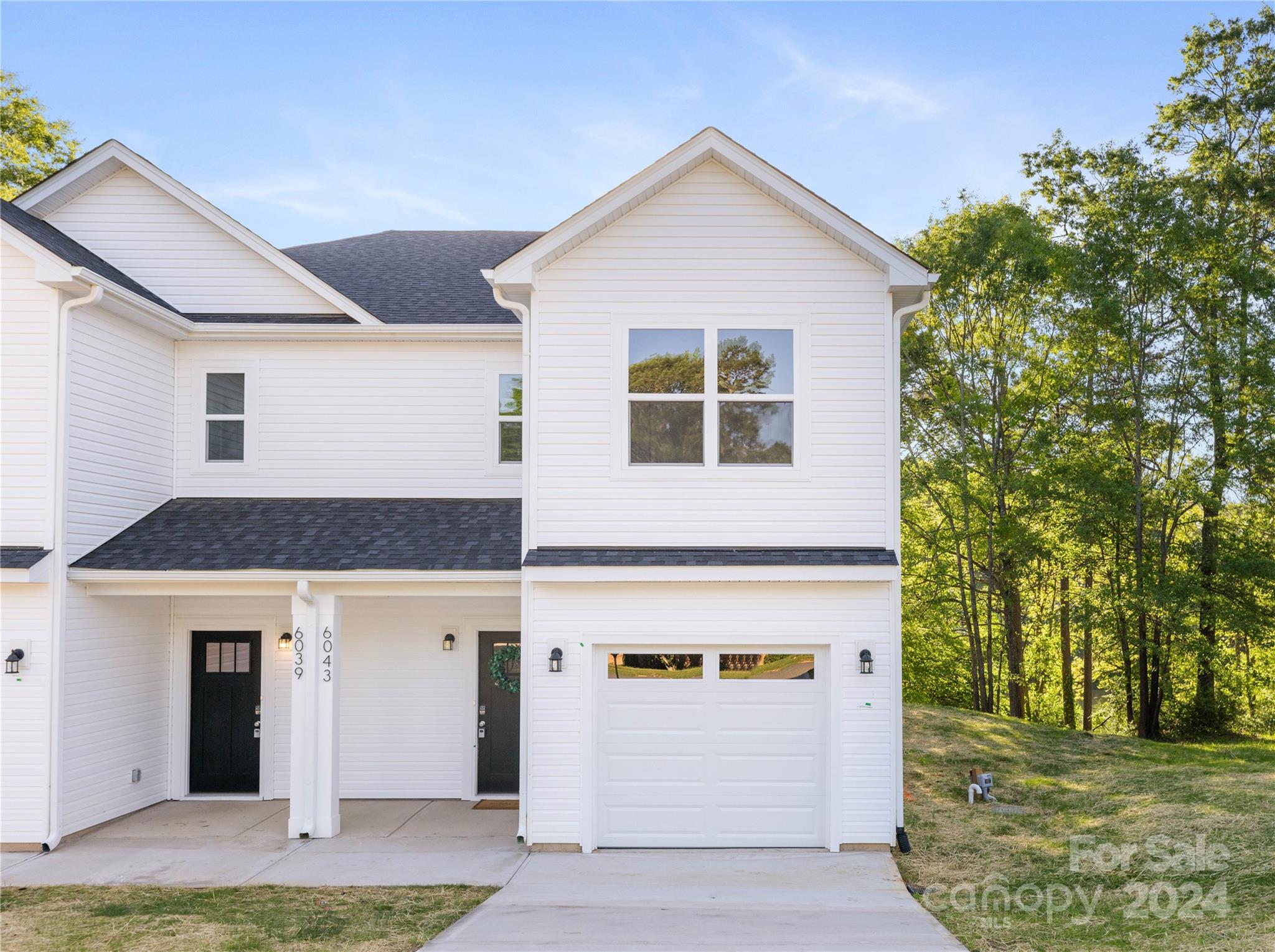 4317 Perkins Road Charlotte, NC 28269 - Photo 24 of 29 a front view of a house with a yard