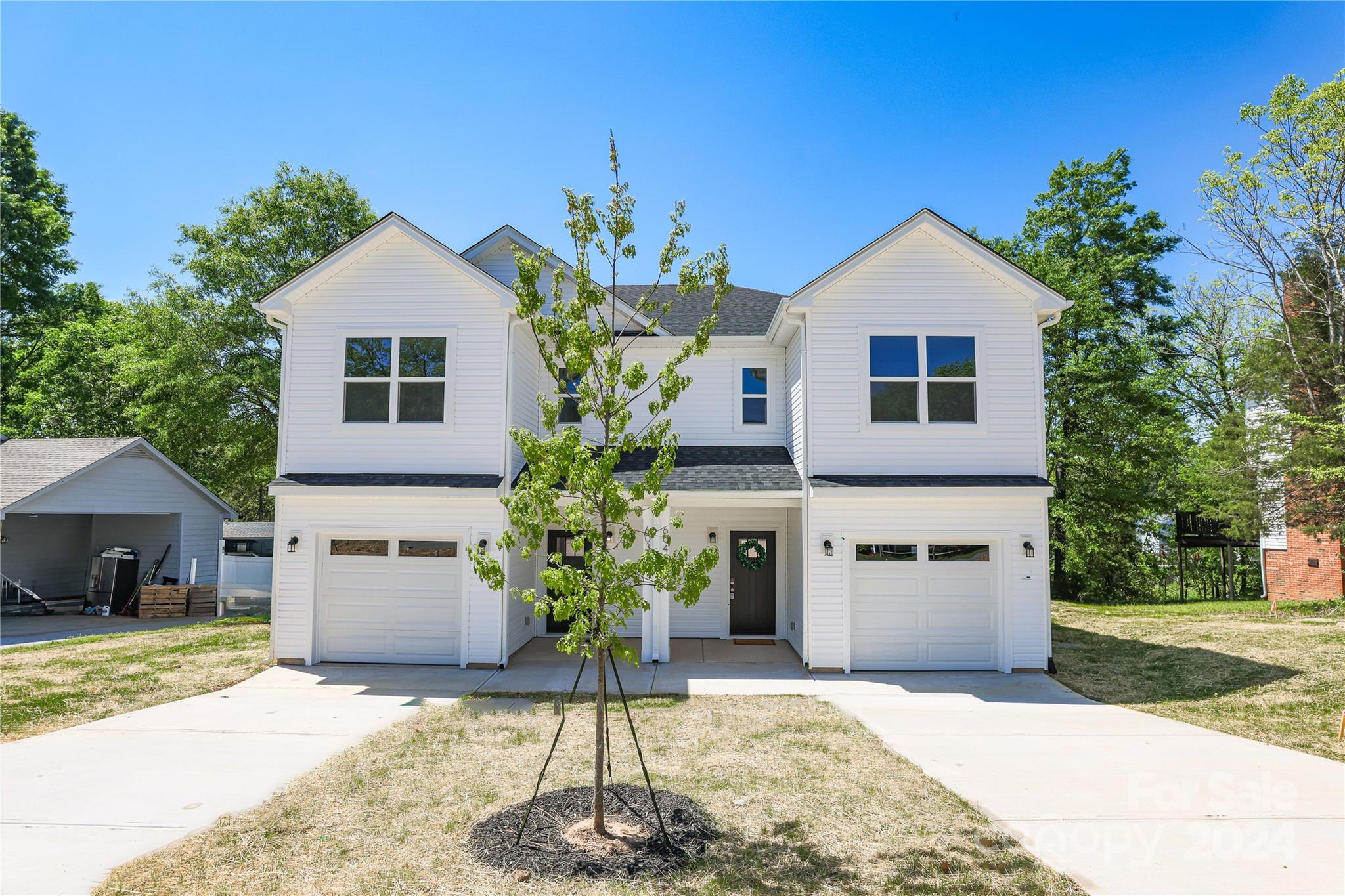 4317 Perkins Road Charlotte, NC 28269 - Photo 26 of 29 a front view of a house with a yard