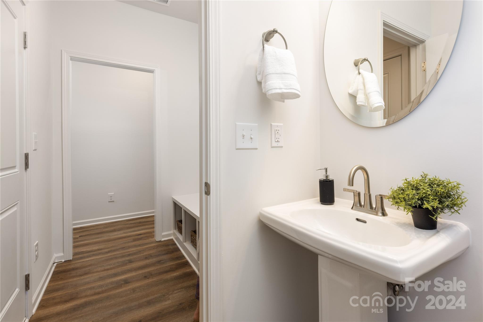 4317 Perkins Road Charlotte, NC 28269 - Photo 6 of 29 a bathroom with a sink and a mirror