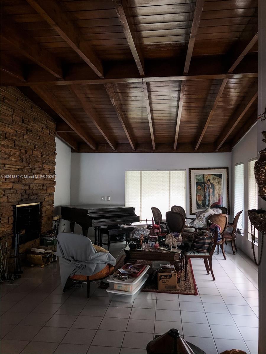 70 Samana Drive Miami, FL 33133 - Photo 5 of 10 a group of chairs sitting in a kitchen next to a window