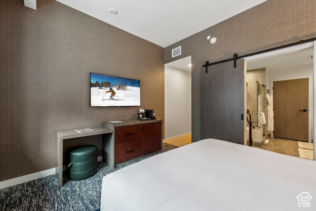 2417 West High Mountain Road, Unit 2202 Park City, UT 84098 - Photo 14 of 28 Bedroom featuring a barn door