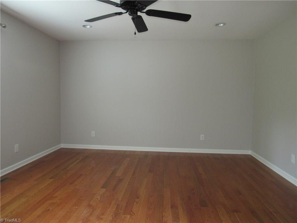 306 Summit Road High Point, NC 27265 - Photo 14 of 27 The master bedroom features hardwoods, recessed lighting and a ceiling fan. A king bed fits in this space.