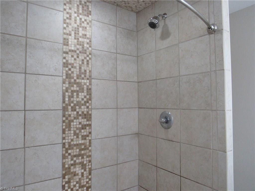 306 Summit Road High Point, NC 27265 - Photo 16 of 27 The owners updated all the baths in this house and especially loved their master shower.