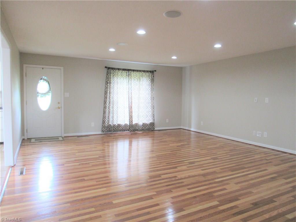 306 Summit Road High Point, NC 27265 - Photo 3 of 27 Beautiful hardwoods begin in the living room and extend throughout the well cared for home.