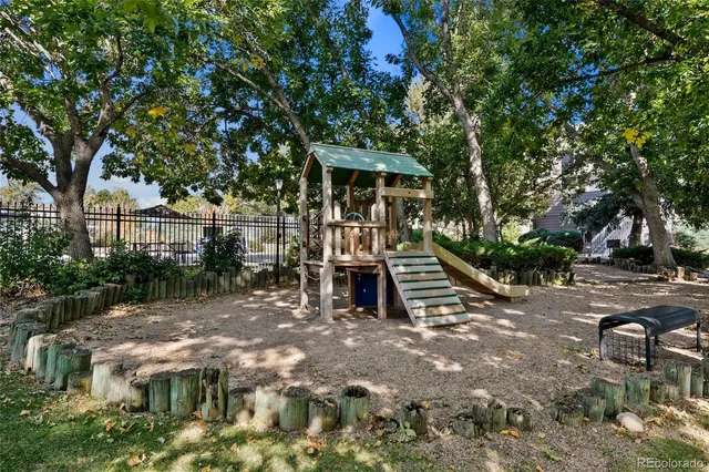 a view of a backyard with sitting area