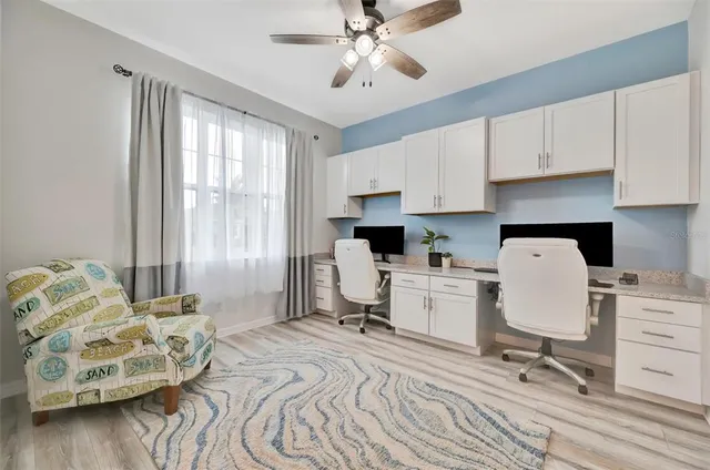 a workspace with furniture and window