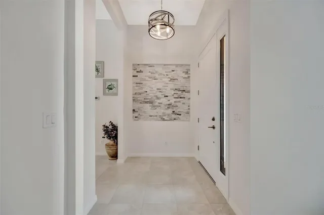 a spacious bedroom with a bed and a window