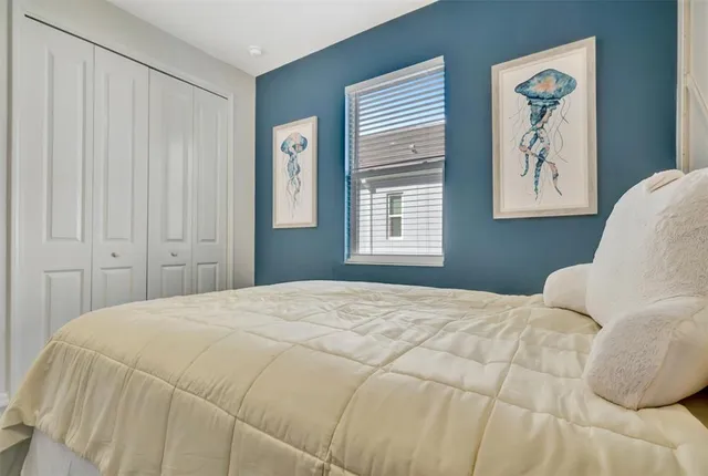 a spacious bathroom with a double vanity sink toilet mirror and shower