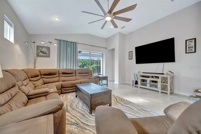 a living room with furniture and a large window