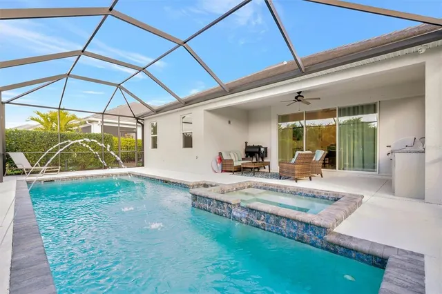 a view of yard with a table and chairs under an umbrella