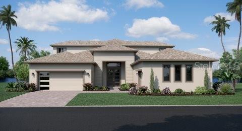 8834 Sanders Tree Loop Wesley Chapel, FL 33545 - Photo 1 of 1 a front view of a house with a garden and plants