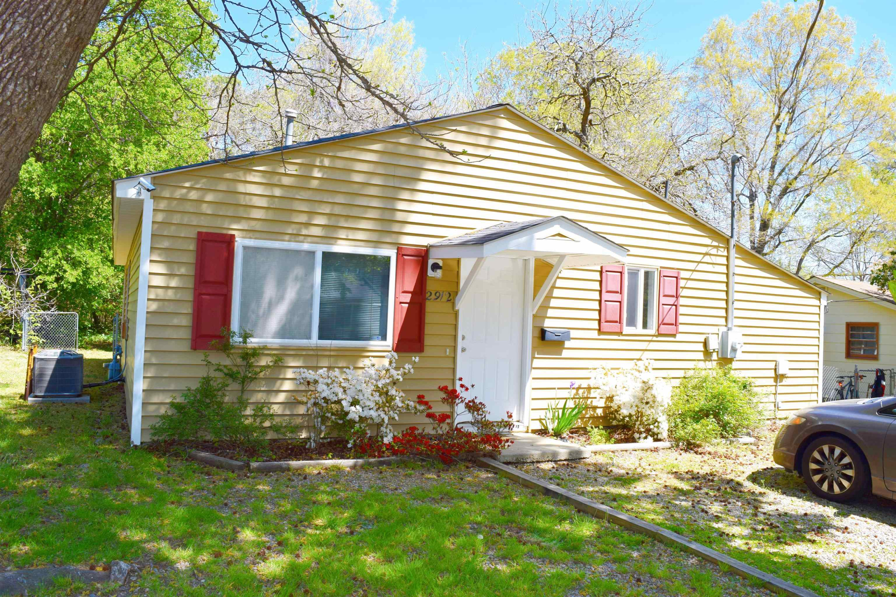 2912 Okelly Street Raleigh, NC 27607 - Photo 1 of 11 a front view of a house with a yard and garage