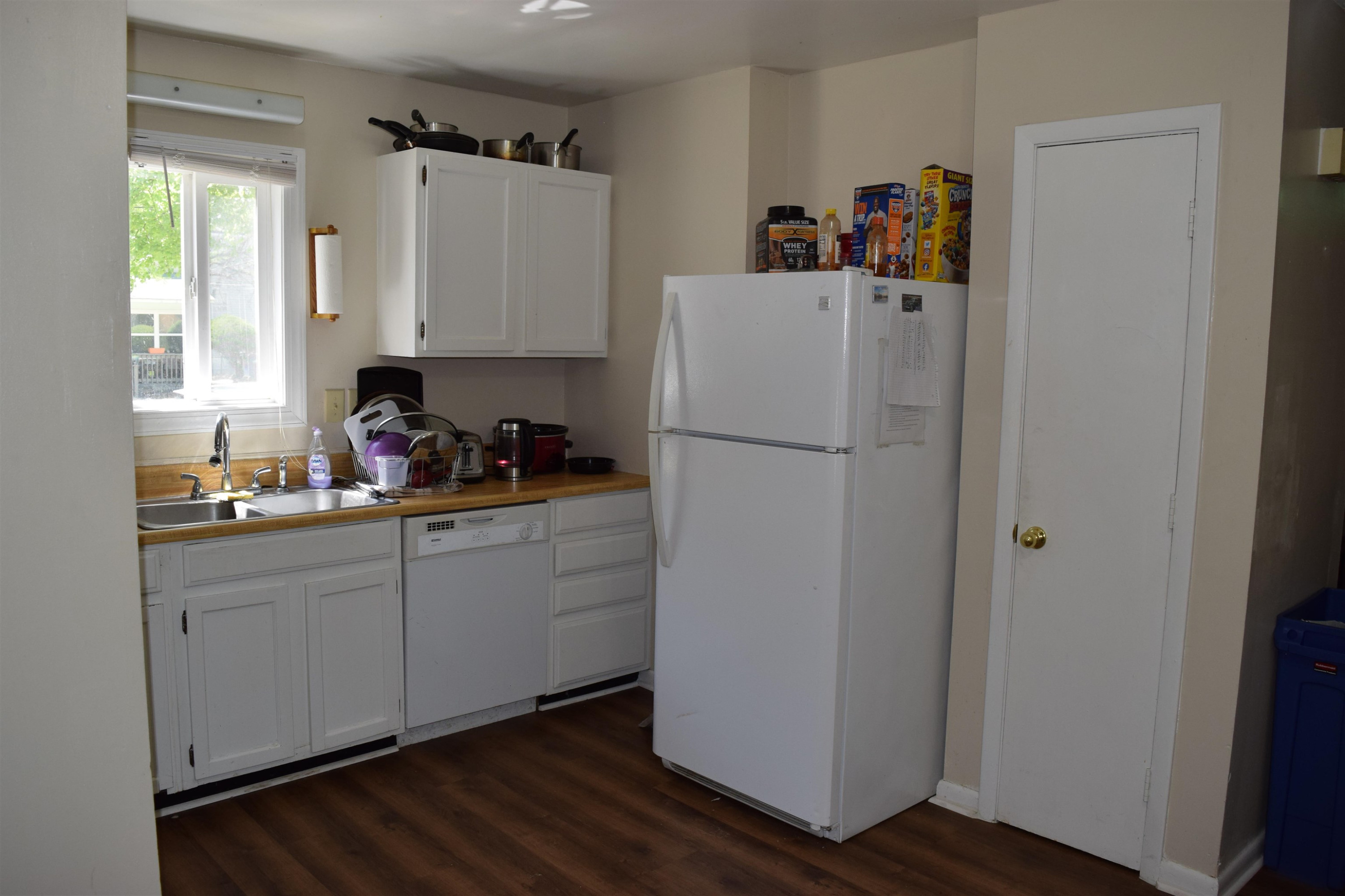 2912 Okelly Street Raleigh, NC 27607 - Photo 8 of 11 a white refrigerator freezer sitting inside of a kitchen