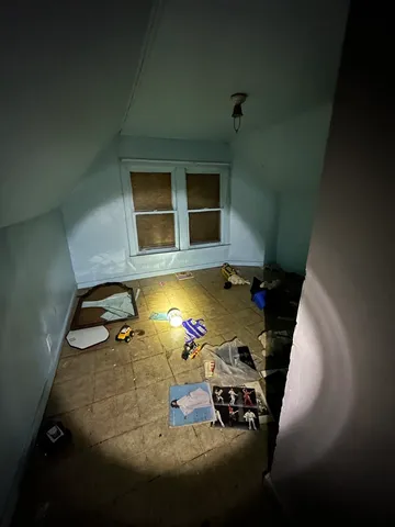 a bathroom with a sink mirror and bathtub