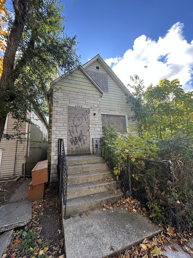 2921 East 78th Place Chicago, IL 60649 - Photo 2 of 18 a view of a house with a yard and large tree