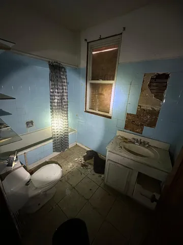 a bed room with a bed and a window