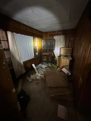 a view of a livingroom with furniture and windows