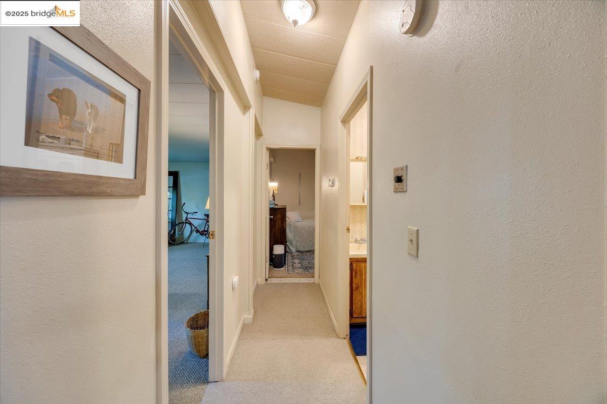 14192 Tuolumne Road, Unit 67 Sonora, CA 95370 - Photo 12 of 26 a view of a hallway with wooden shelves
