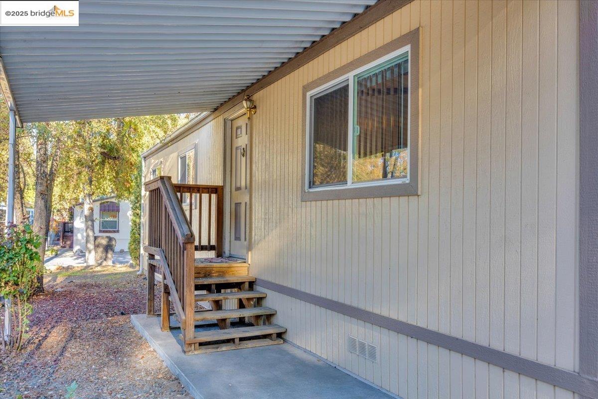 14192 Tuolumne Road, Unit 67 Sonora, CA 95370 - Photo 21 of 26 a view of an entryway with wooden floor