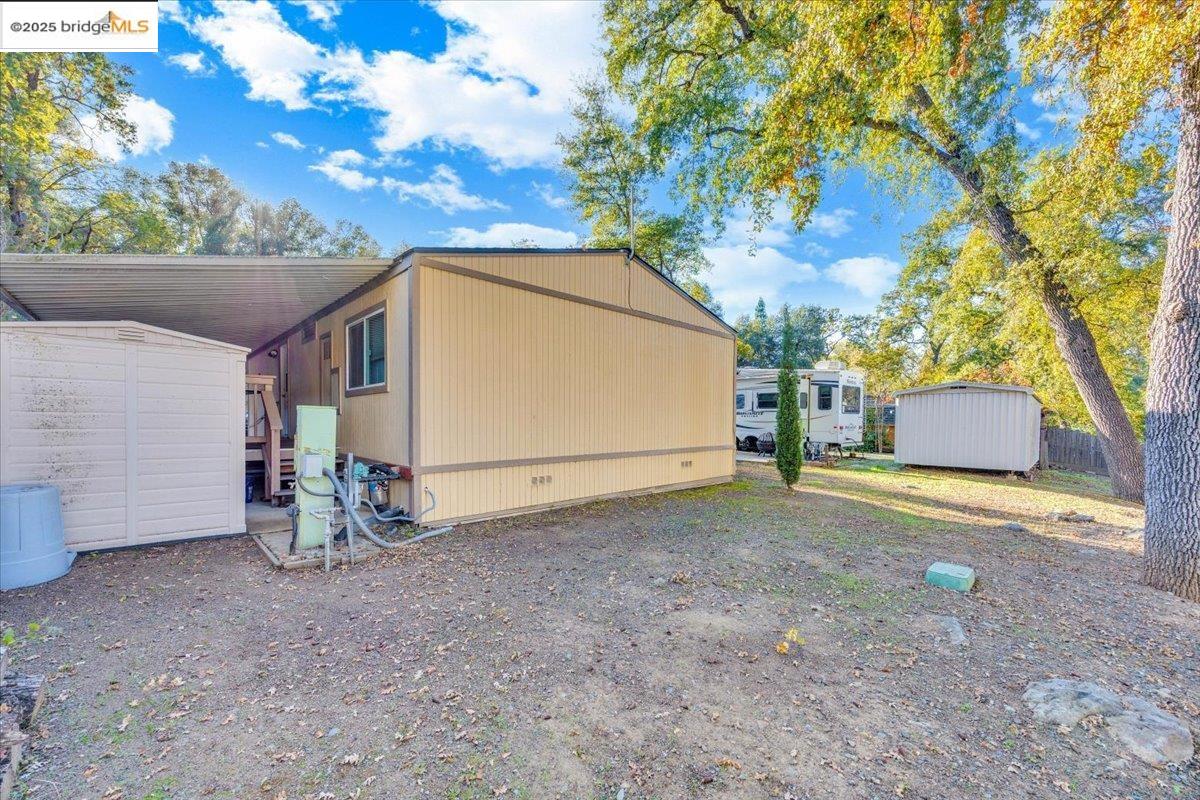 14192 Tuolumne Road, Unit 67 Sonora, CA 95370 - Photo 23 of 26 a view of backyard and tree