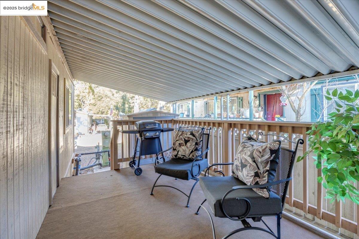 14192 Tuolumne Road, Unit 67 Sonora, CA 95370 - Photo 5 of 26 a view of a chairs in balcony