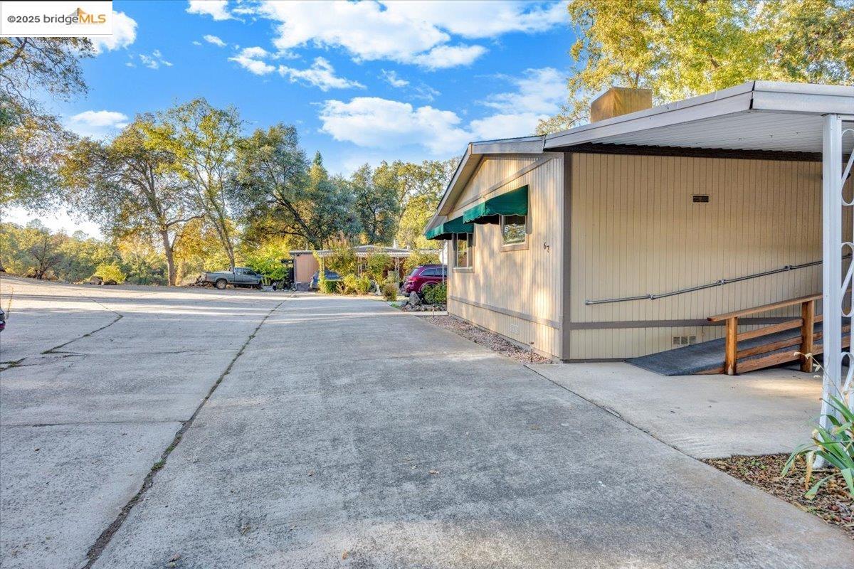 14192 Tuolumne Road, Unit 67 Sonora, CA 95370 - Photo 8 of 26 a view of a house with a outdoor space