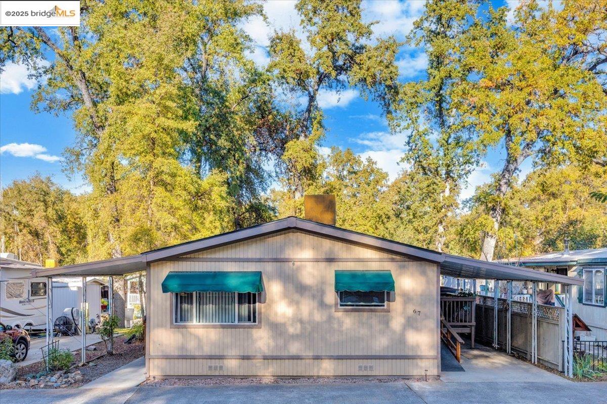 14192 Tuolumne Road, Unit 67 Sonora, CA 95370 - Photo 9 of 26 a front view of a house with plants