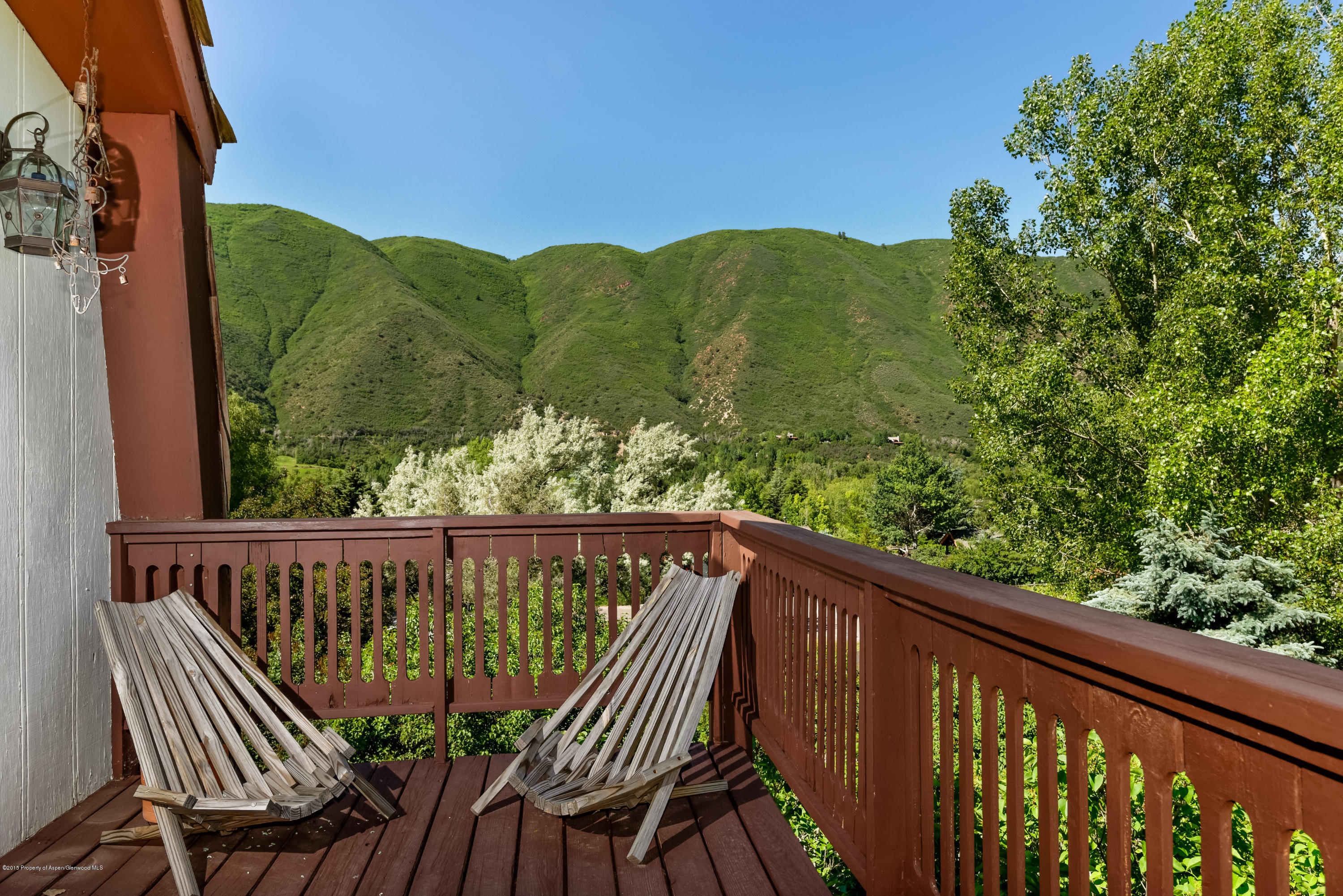 336 Holland Hills Road Basalt, CO 81621 - Photo 14 of 17 a view of balcony with wooden floor and outdoor seating