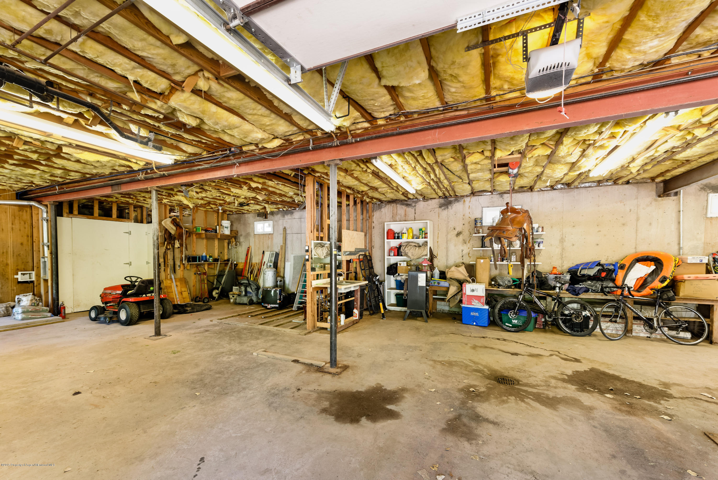 336 Holland Hills Road Basalt, CO 81621 - Photo 17 of 17 a view of a garage with a lot of stuff