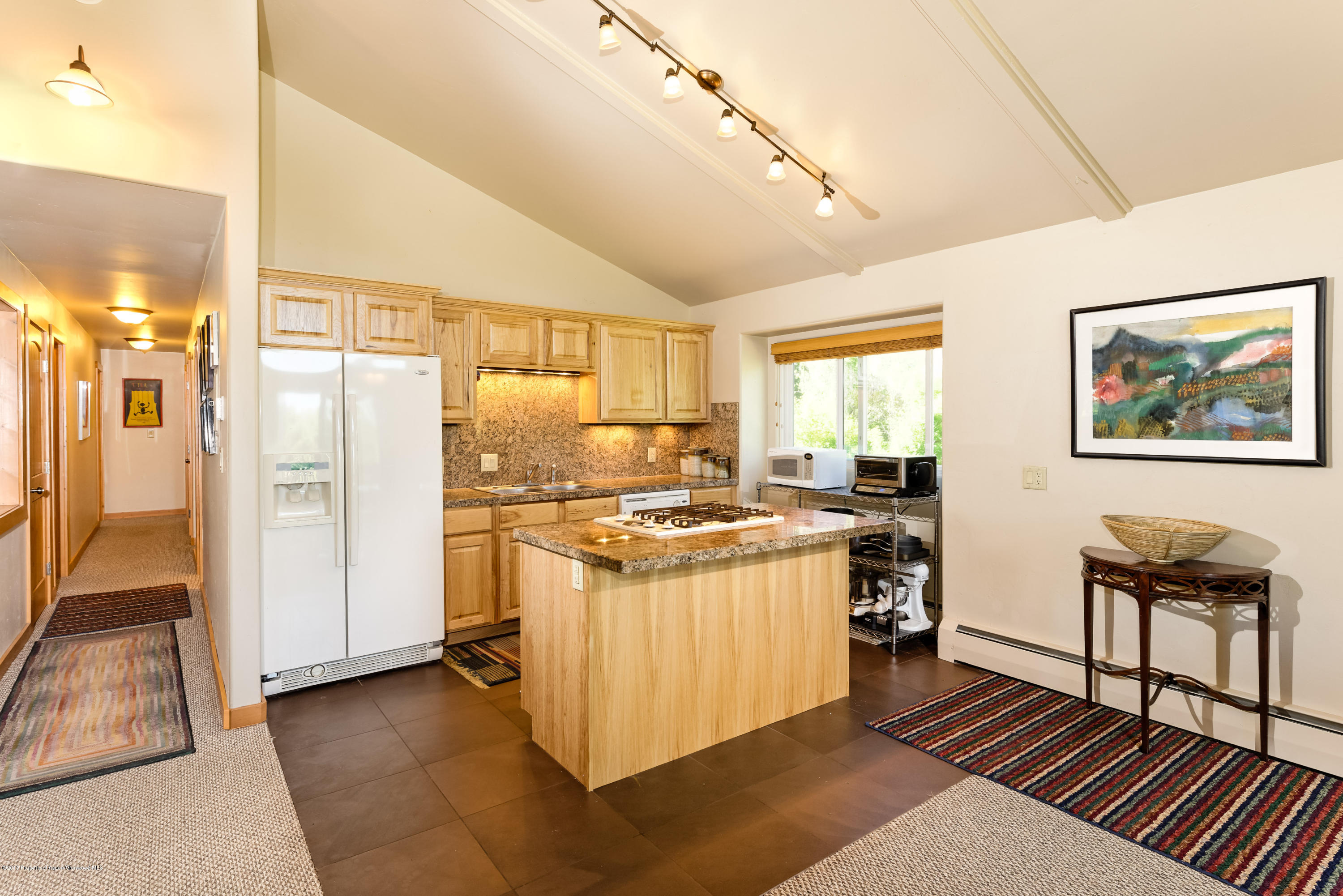 336 Holland Hills Road Basalt, CO 81621 - Photo 3 of 17 a kitchen with stainless steel appliances granite countertop a stove and a refrigerator