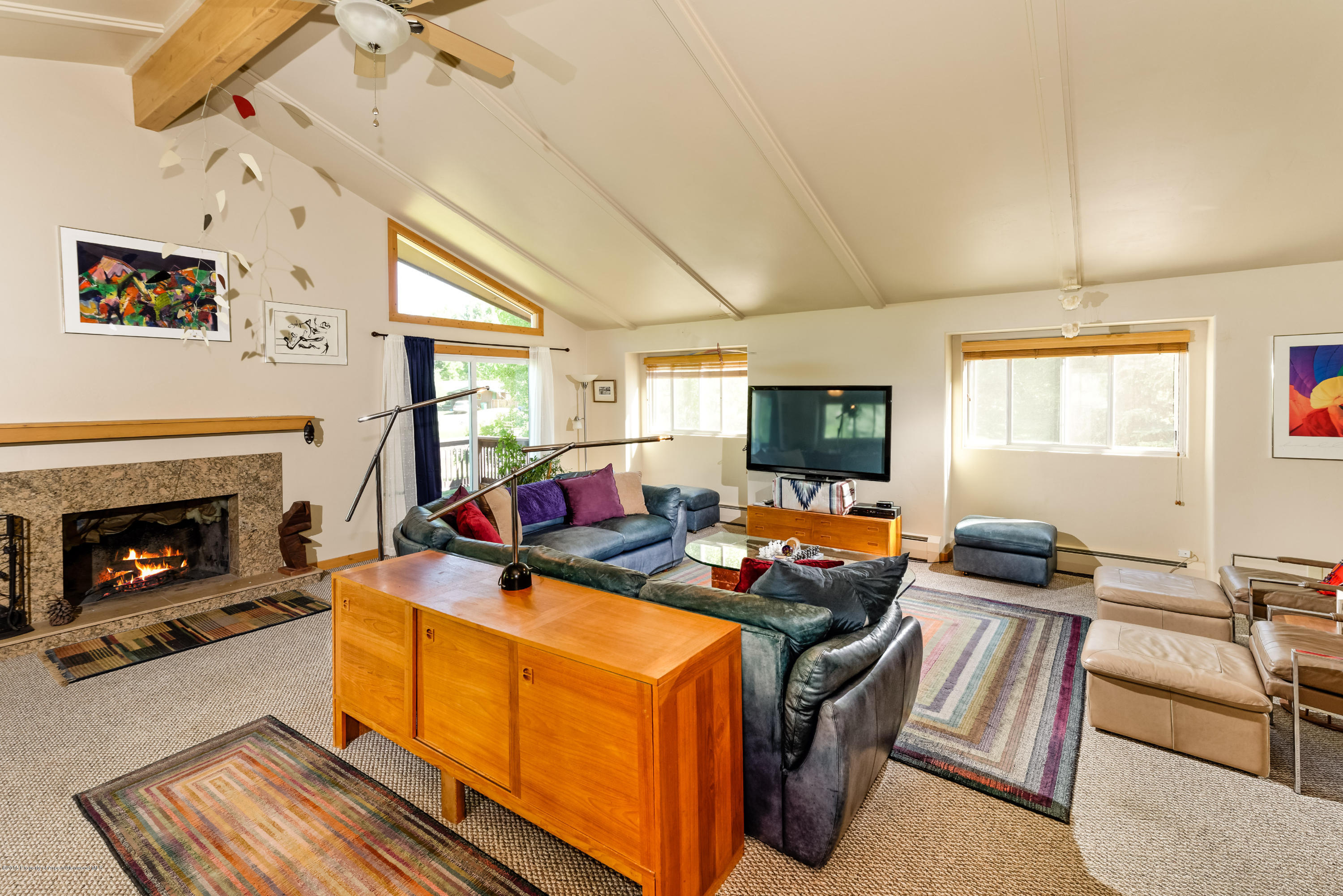 336 Holland Hills Road Basalt, CO 81621 - Photo 6 of 17 a living room with furniture and a fireplace