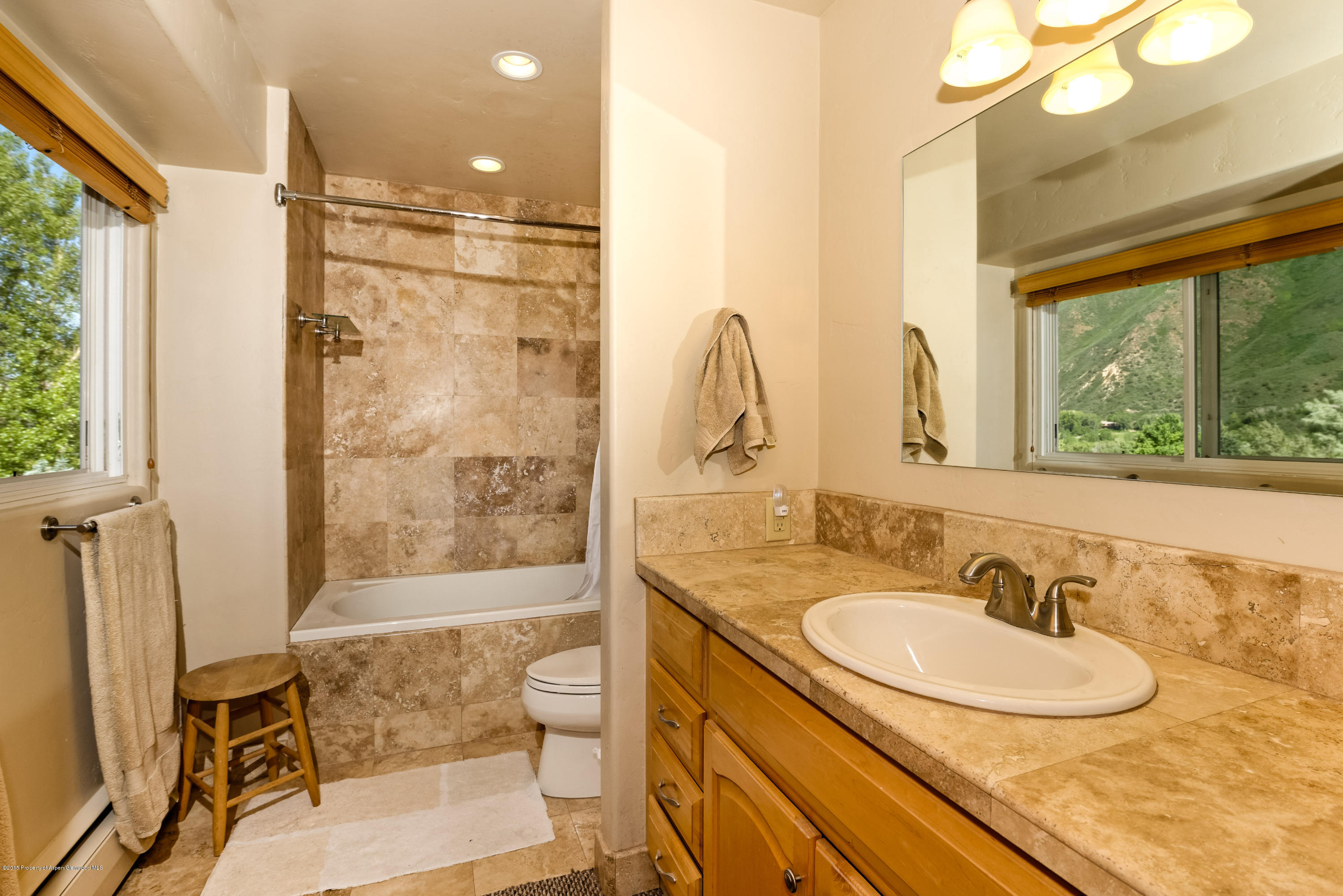 336 Holland Hills Road Basalt, CO 81621 - Photo 9 of 17 a bathroom with a sink double vanity and a mirror