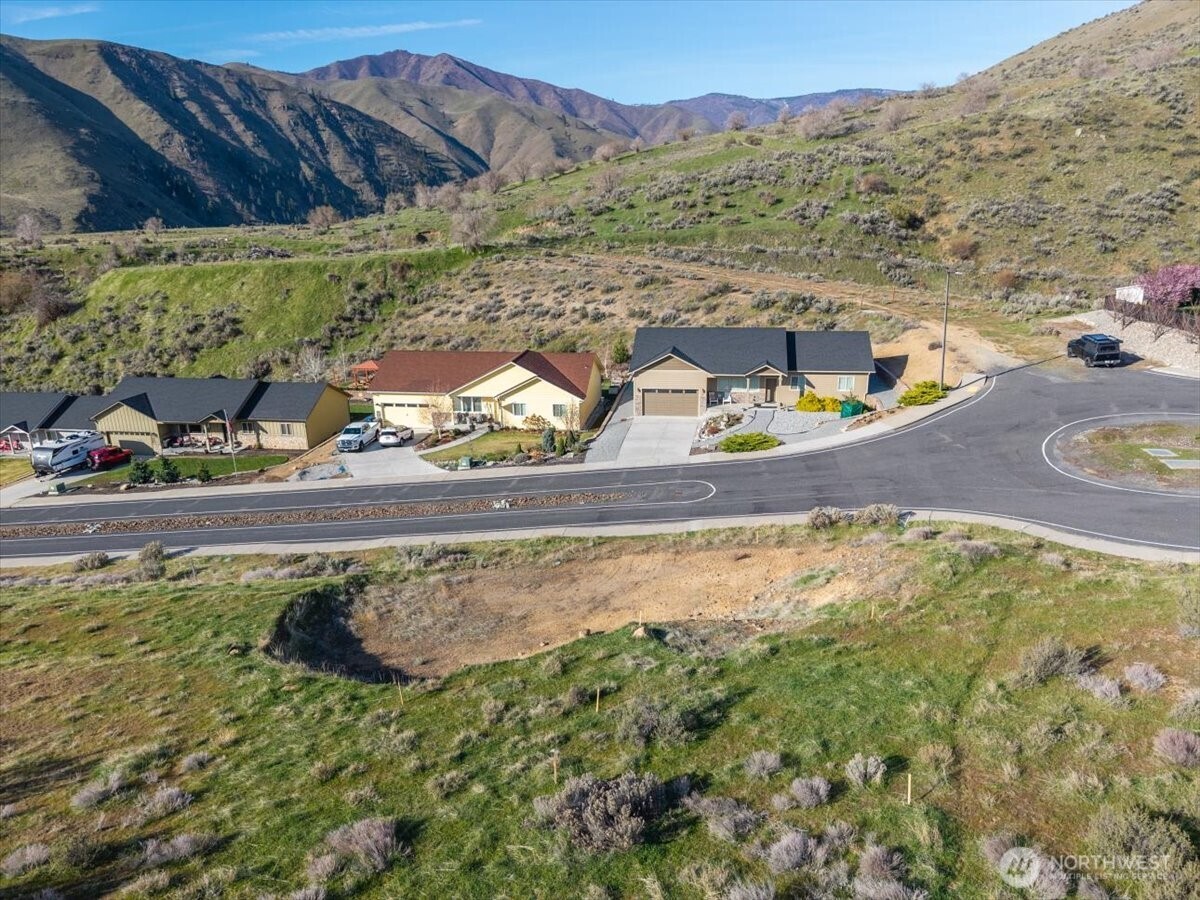9988 Saska Way Entiat, WA 98822 - Photo 15 of 21 a view of a swimming pool with a yard