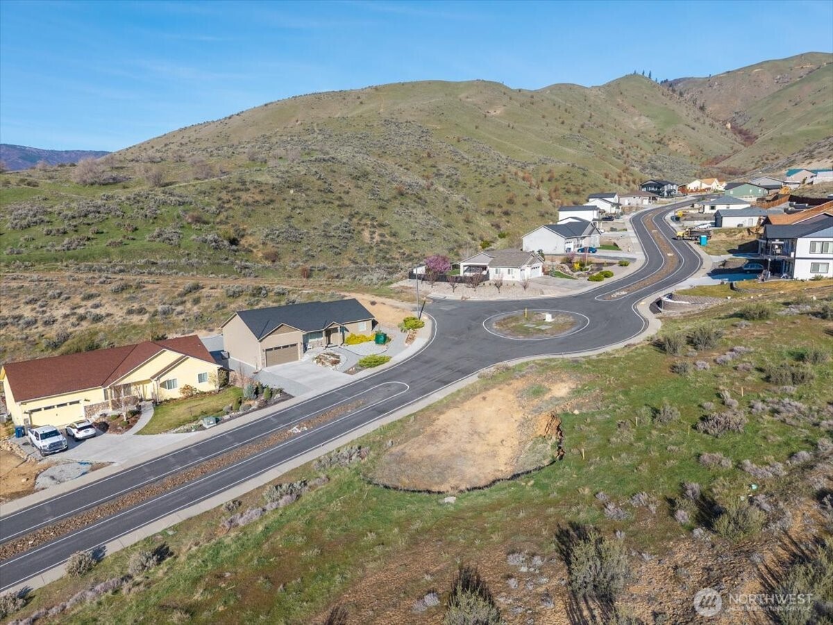 9988 Saska Way Entiat, WA 98822 - Photo 16 of 21 a view of a mountain from a yard