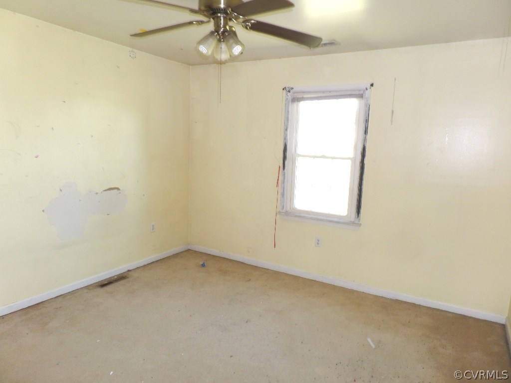 19002 Beaver Dam Road Beaverdam, VA 23015 - Photo 11 of 19 an empty room with a window and a fan