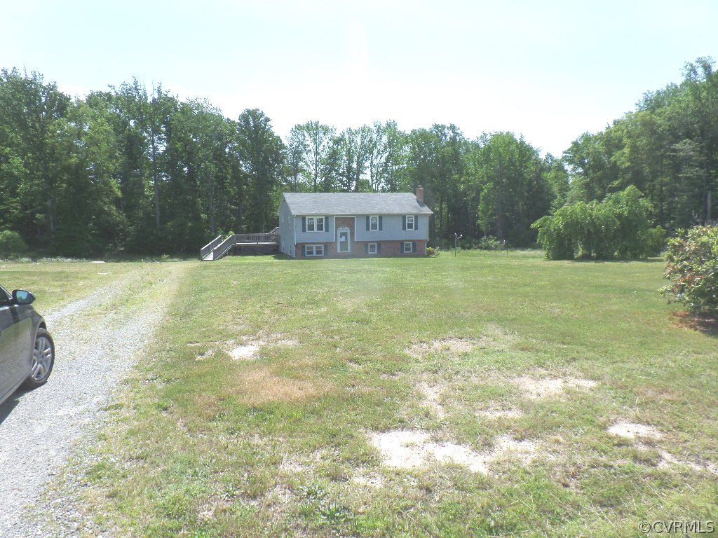 19002 Beaver Dam Road Beaverdam, VA 23015 - Photo 17 of 19 a view of a field with trees in the background