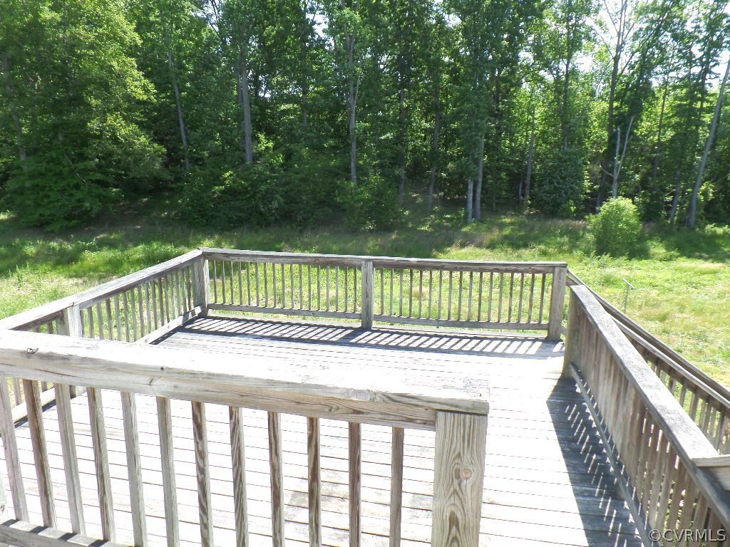 19002 Beaver Dam Road Beaverdam, VA 23015 - Photo 18 of 19 a view of a roof deck with wooden fence and floor