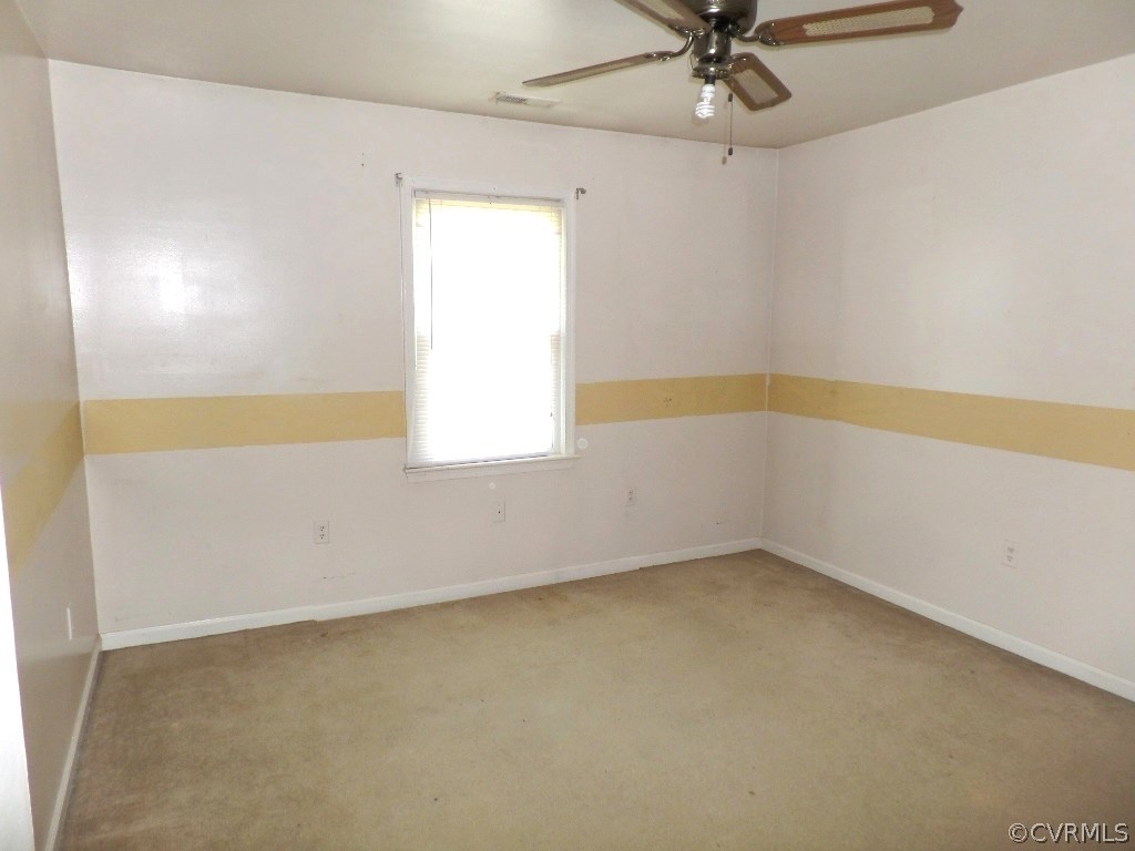 19002 Beaver Dam Road Beaverdam, VA 23015 - Photo 8 of 19 an empty room with a window and a ceiling fan