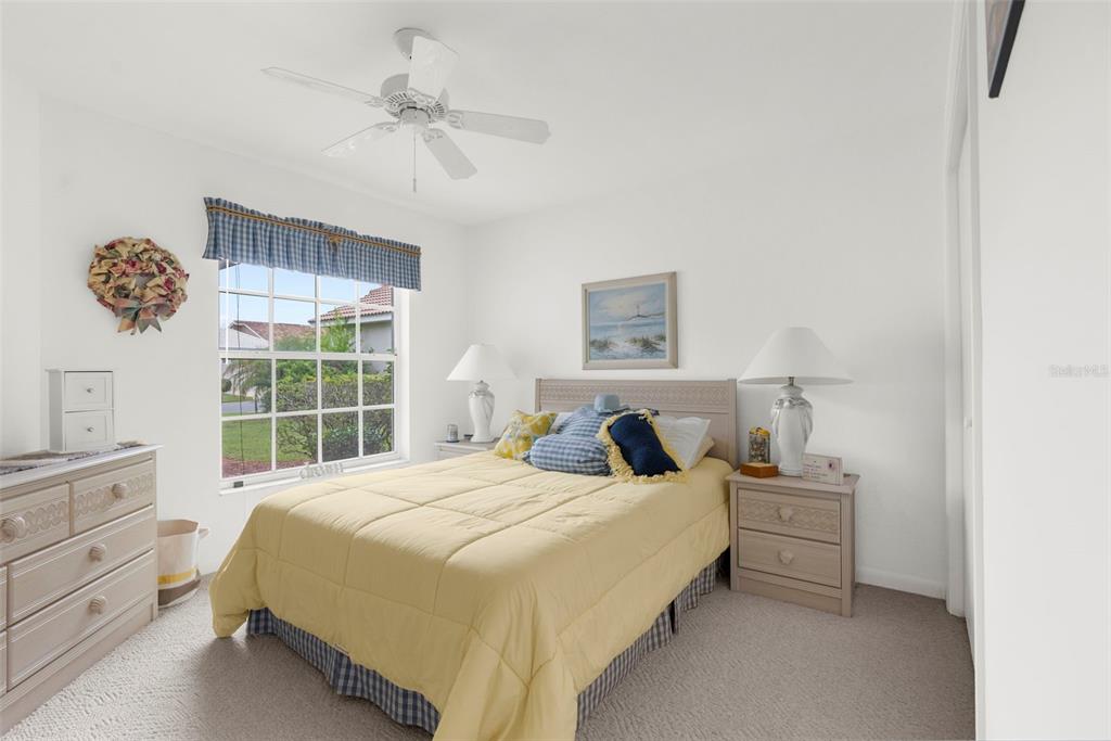 9426 Mississippi Run Weeki Wachee, FL 34613 - Photo 16 of 31 a bedroom with a bed and a window