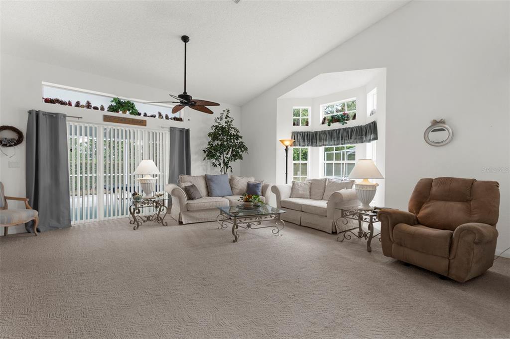 9426 Mississippi Run Weeki Wachee, FL 34613 - Photo 7 of 31 a living room with furniture and a large window