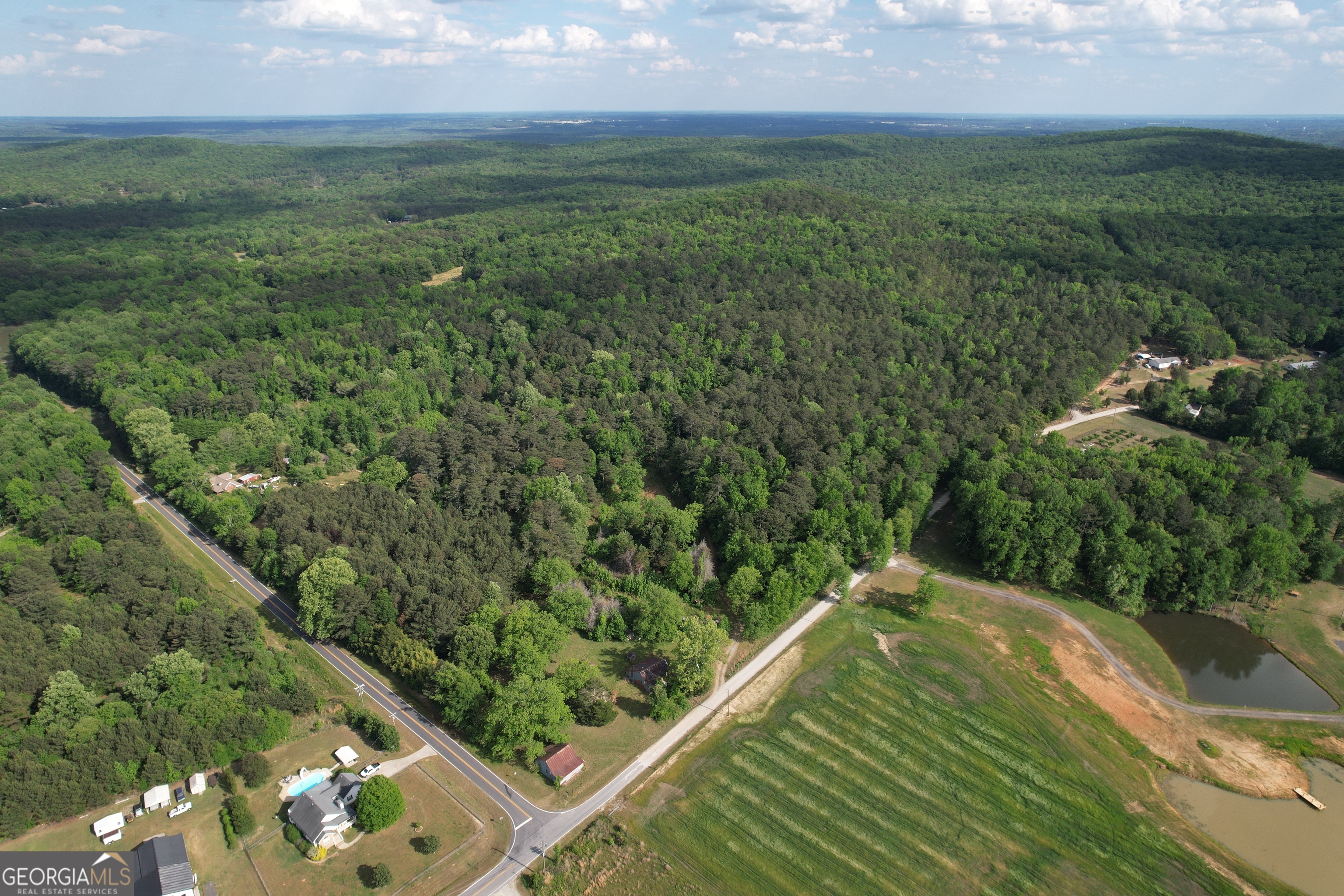 339 Oliver Road Meansville, GA 30256 - Photo 2 of 40 a view of a city from a yard