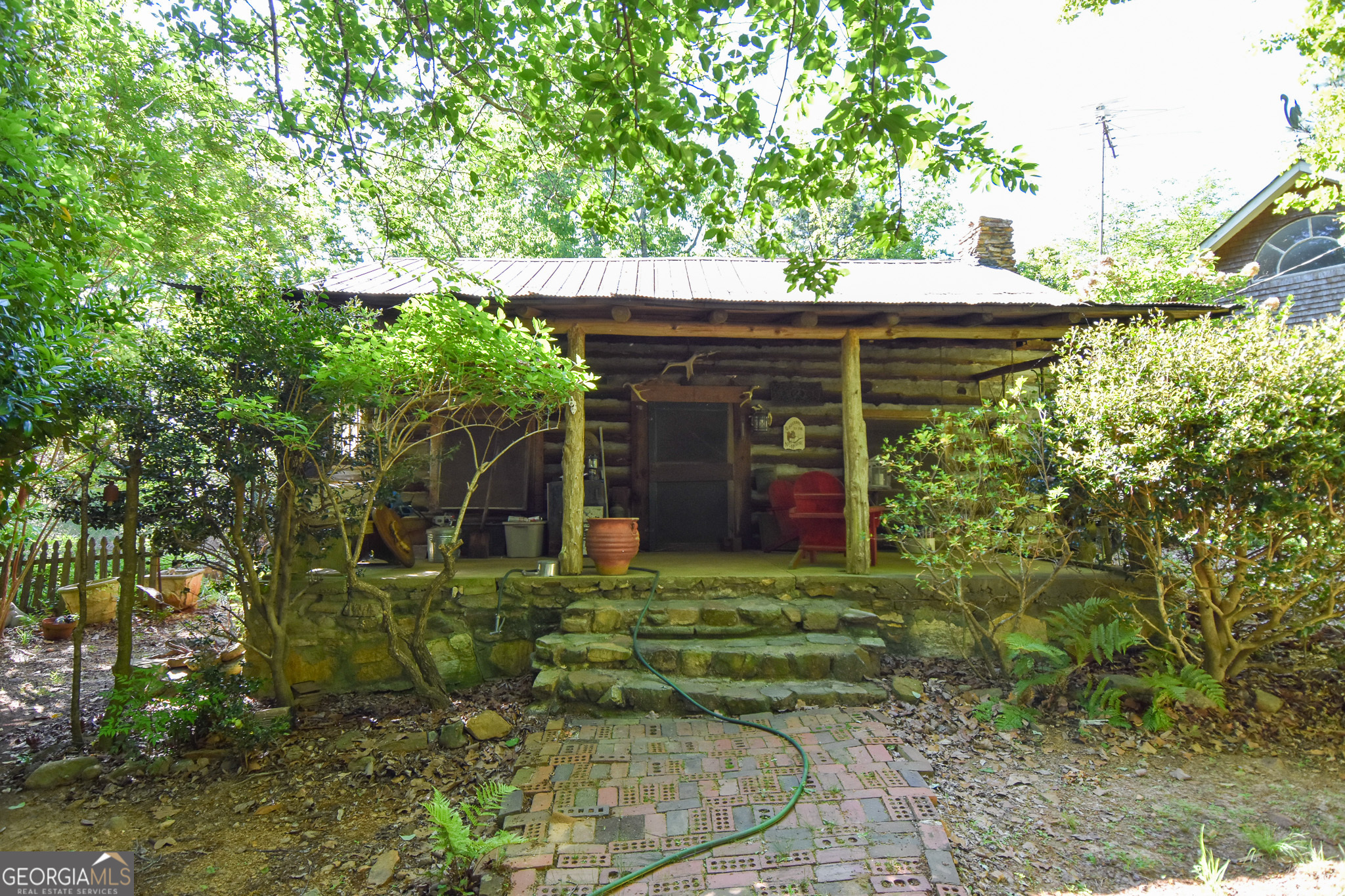 339 Oliver Road Meansville, GA 30256 - Photo 24 of 40 a front view of a house with garden