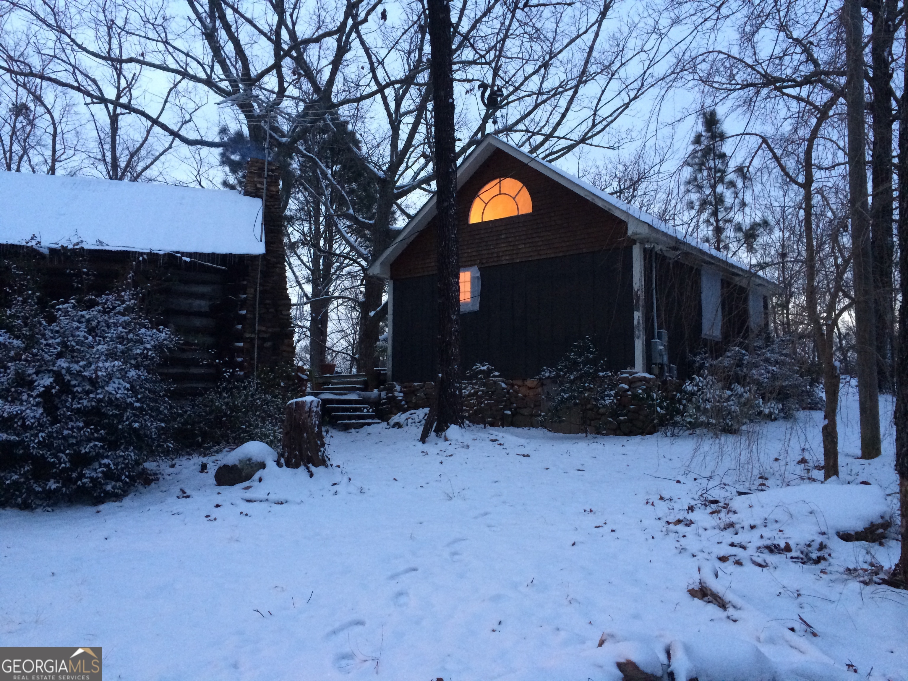 339 Oliver Road Meansville, GA 30256 - Photo 26 of 40 a view of a house with a yard covered in snow