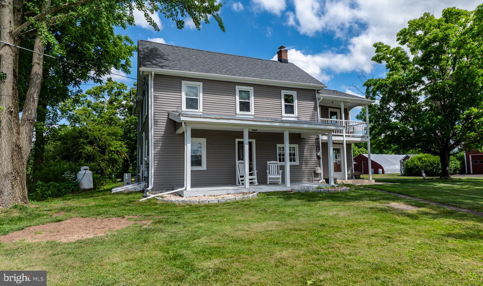 222 Blue School Road Perkasie, PA 18944 - Photo 2 of 77 a front view of a house with a garden