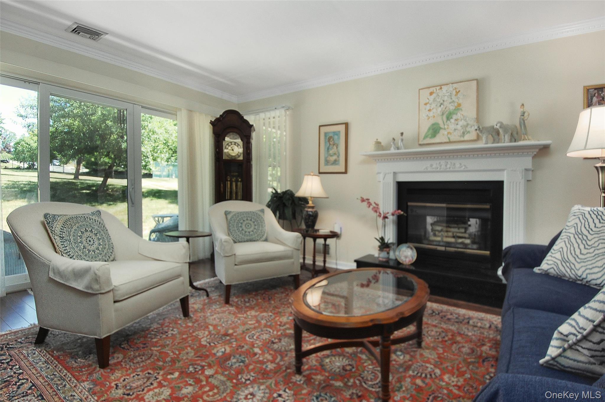 407 Arlin Road, Unit 407 Monroe, NY 10950 - Photo 7 of 33 w/ crown moldings, fireplace & sliders to patio