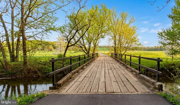 a view of staircase with a table and chairs