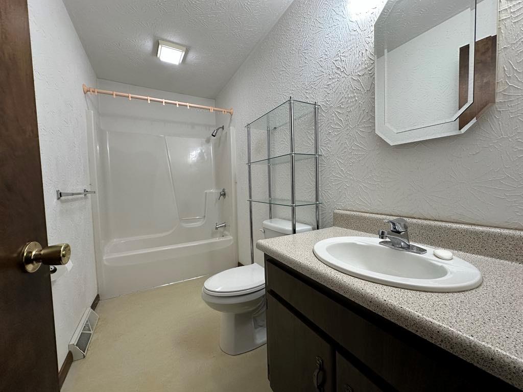 861 Chicora Road Chicora, PA 16025 - Photo 13 of 30 a bathroom with a sink a toilet and shower